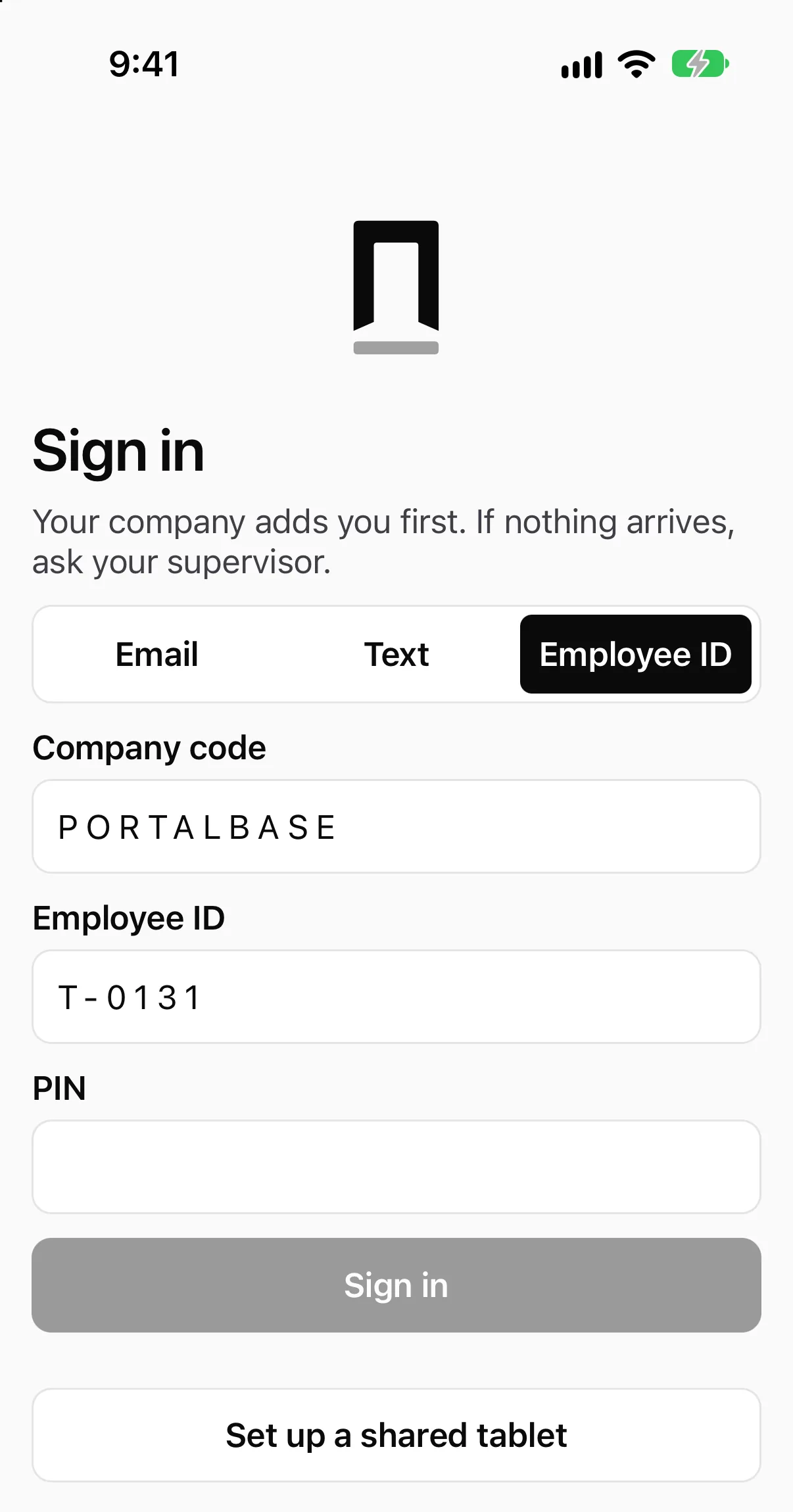 The phone app's Sign in screen on its Employee ID tab: the company code PORTALBASE and the employee ID T-0131 typed in, an empty PIN box, a grayed Sign in button and a Set up a shared tablet button. Tabs for Email and Text sit above.